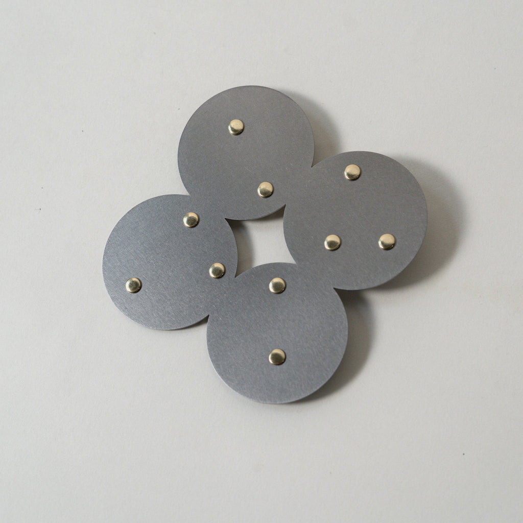 COSMO Coaster A with brass rivets