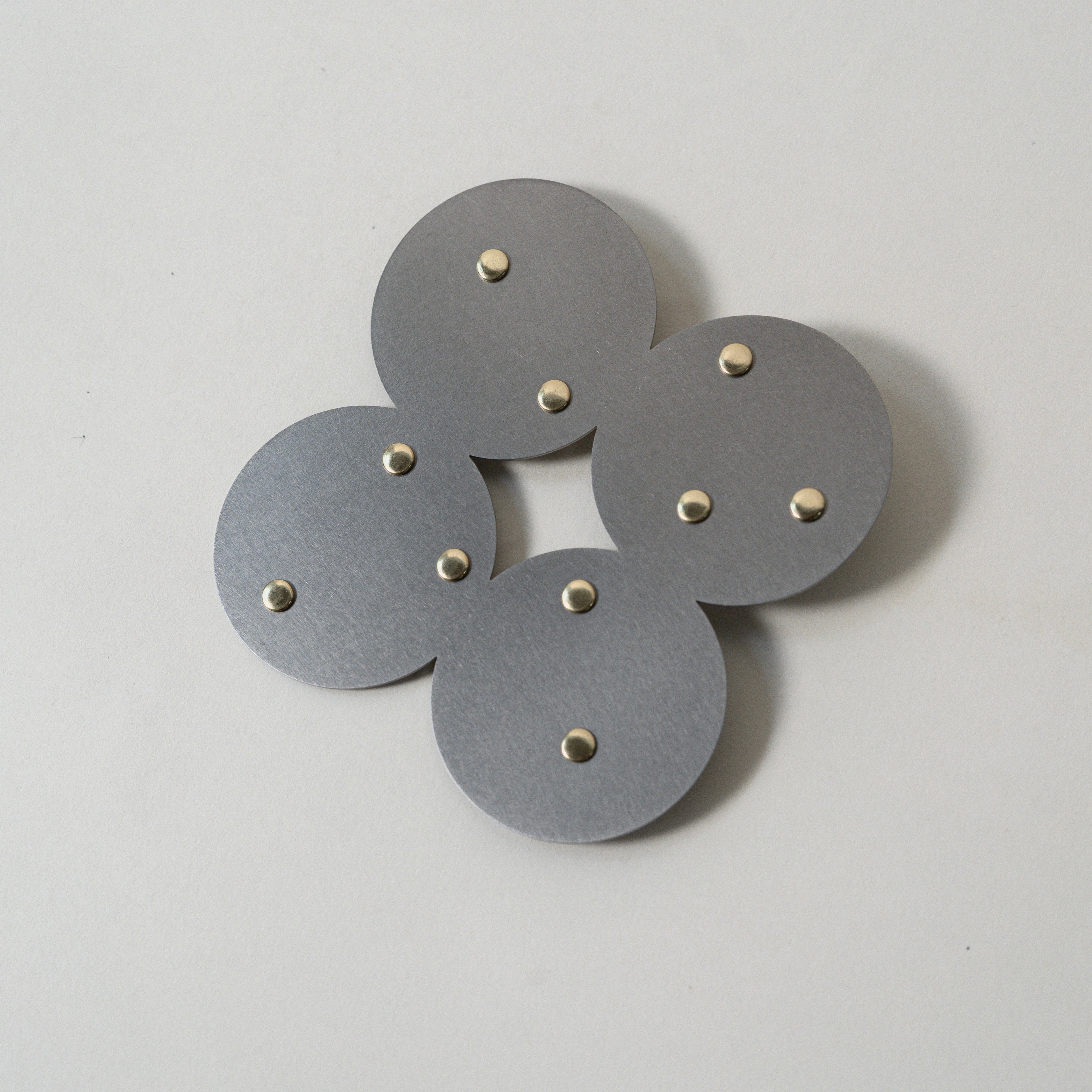 COSMO Coaster A with brass rivets