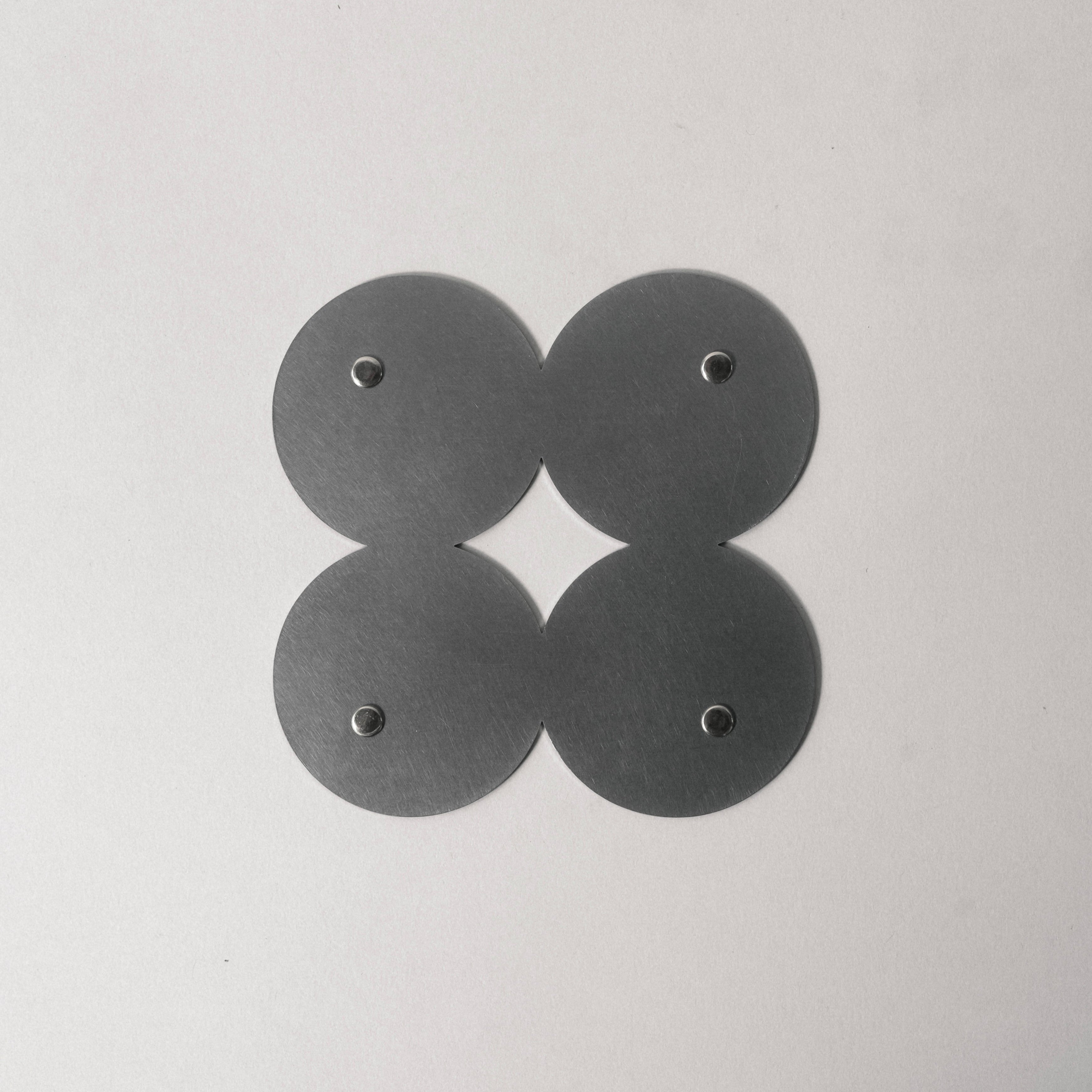 COSMO Coaster B with nickel rivets