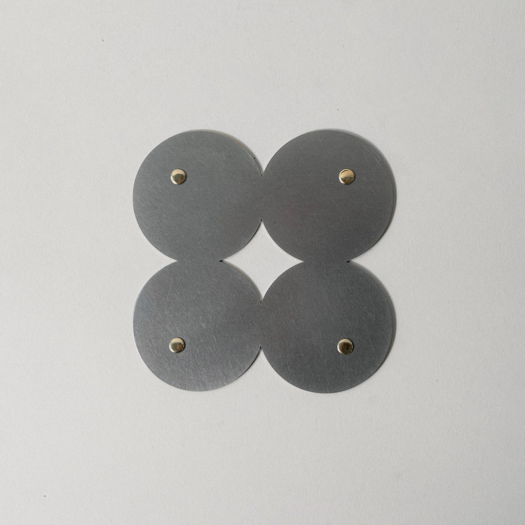 COSMO Coaster B with brass rivets