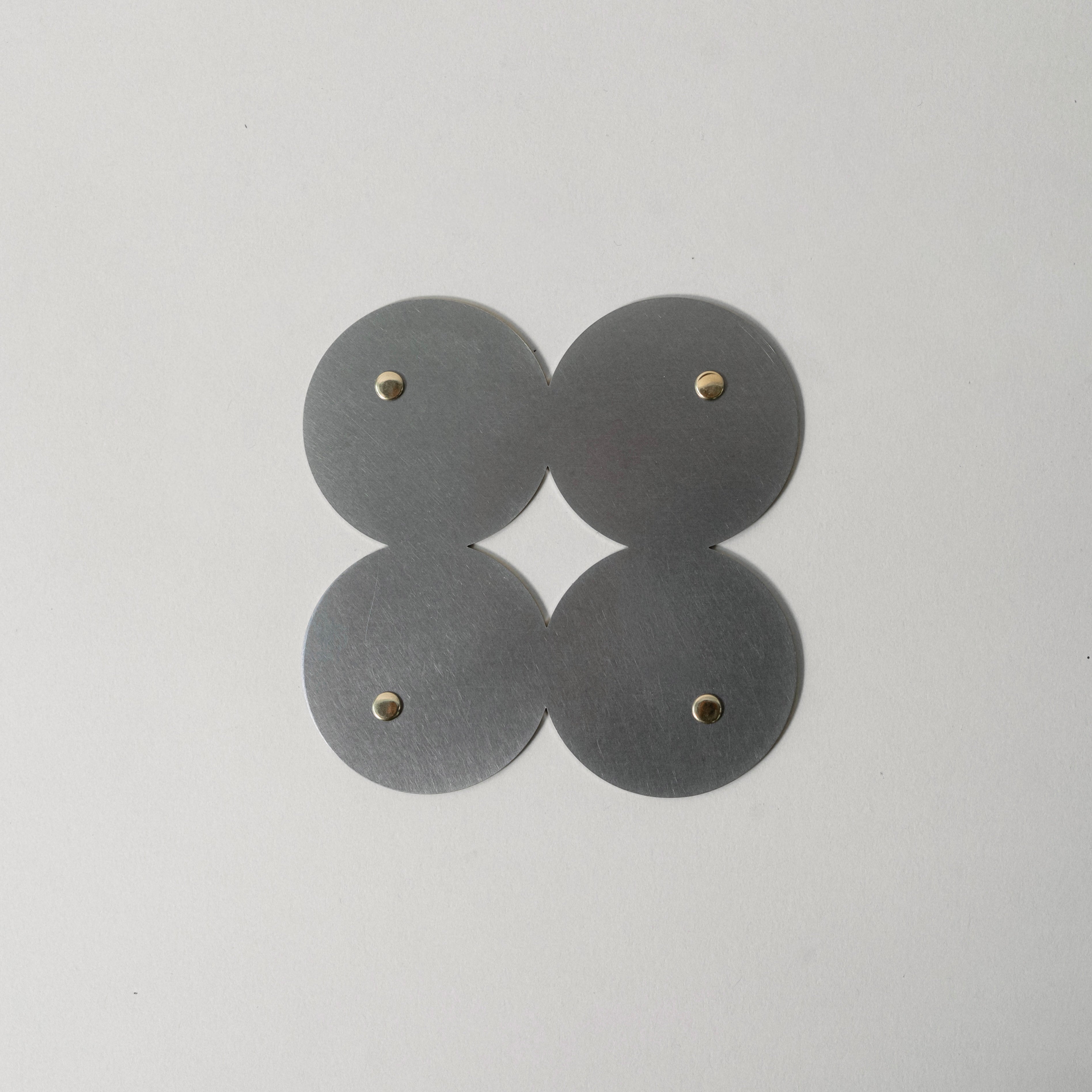 COSMO Coaster B with brass rivets