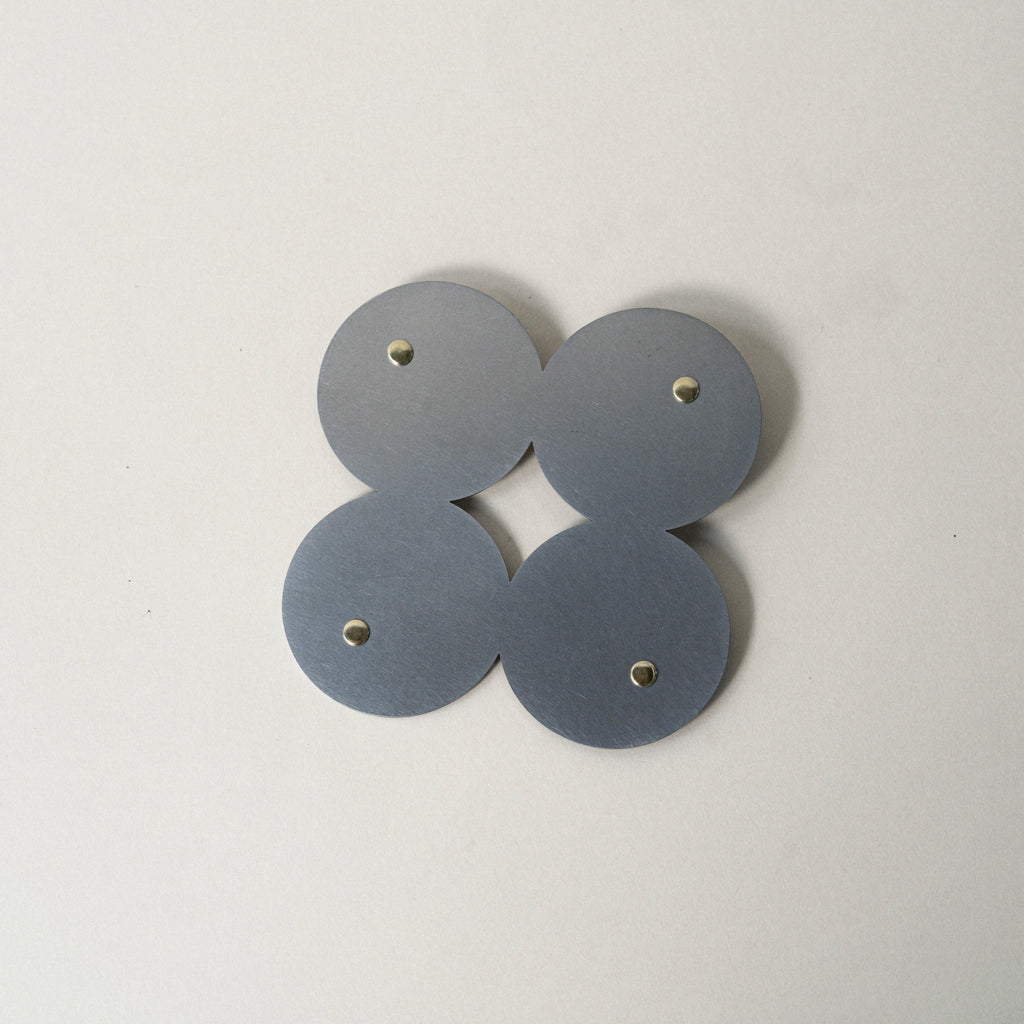 COSMO Coaster B with brass rivets