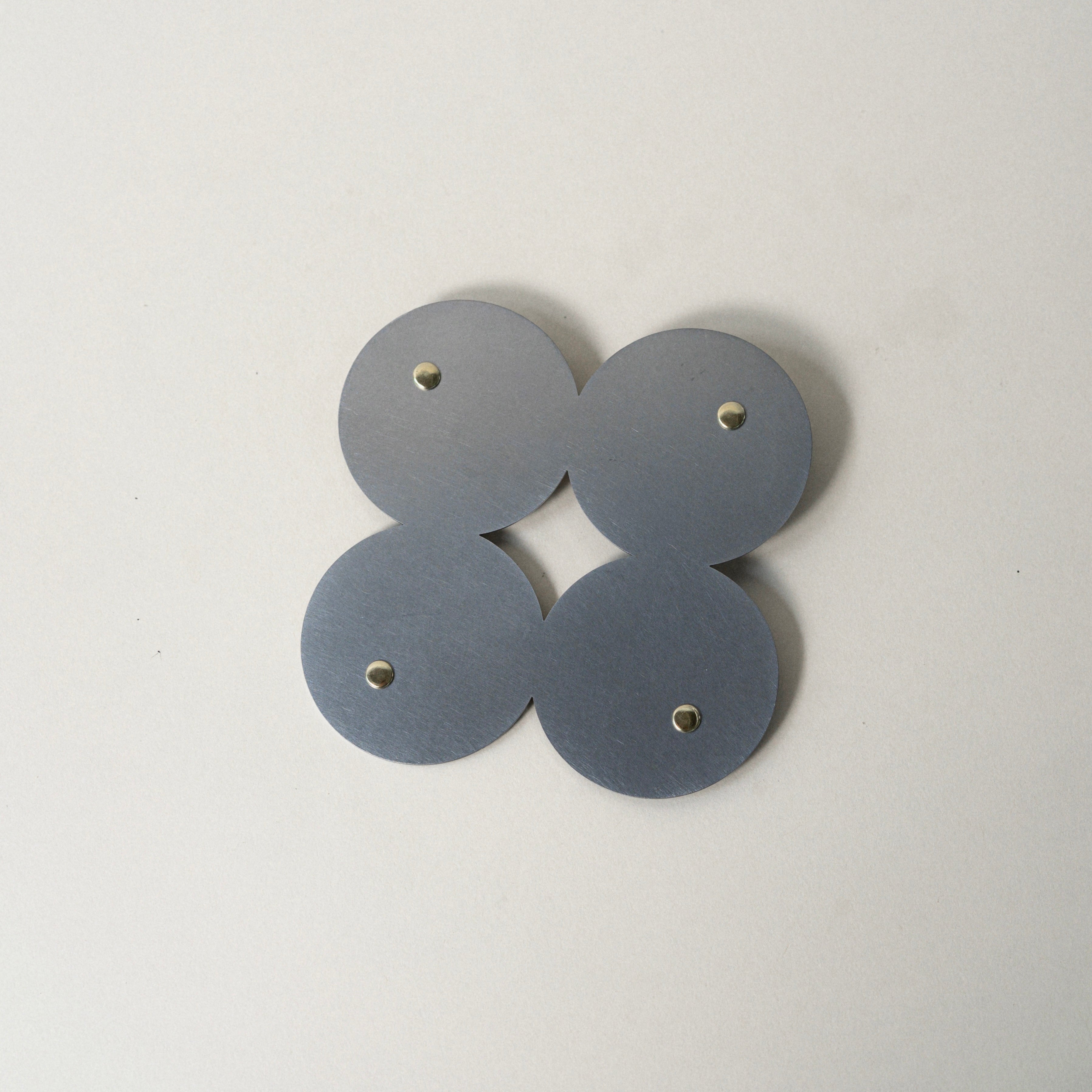 COSMO Coaster B with brass rivets