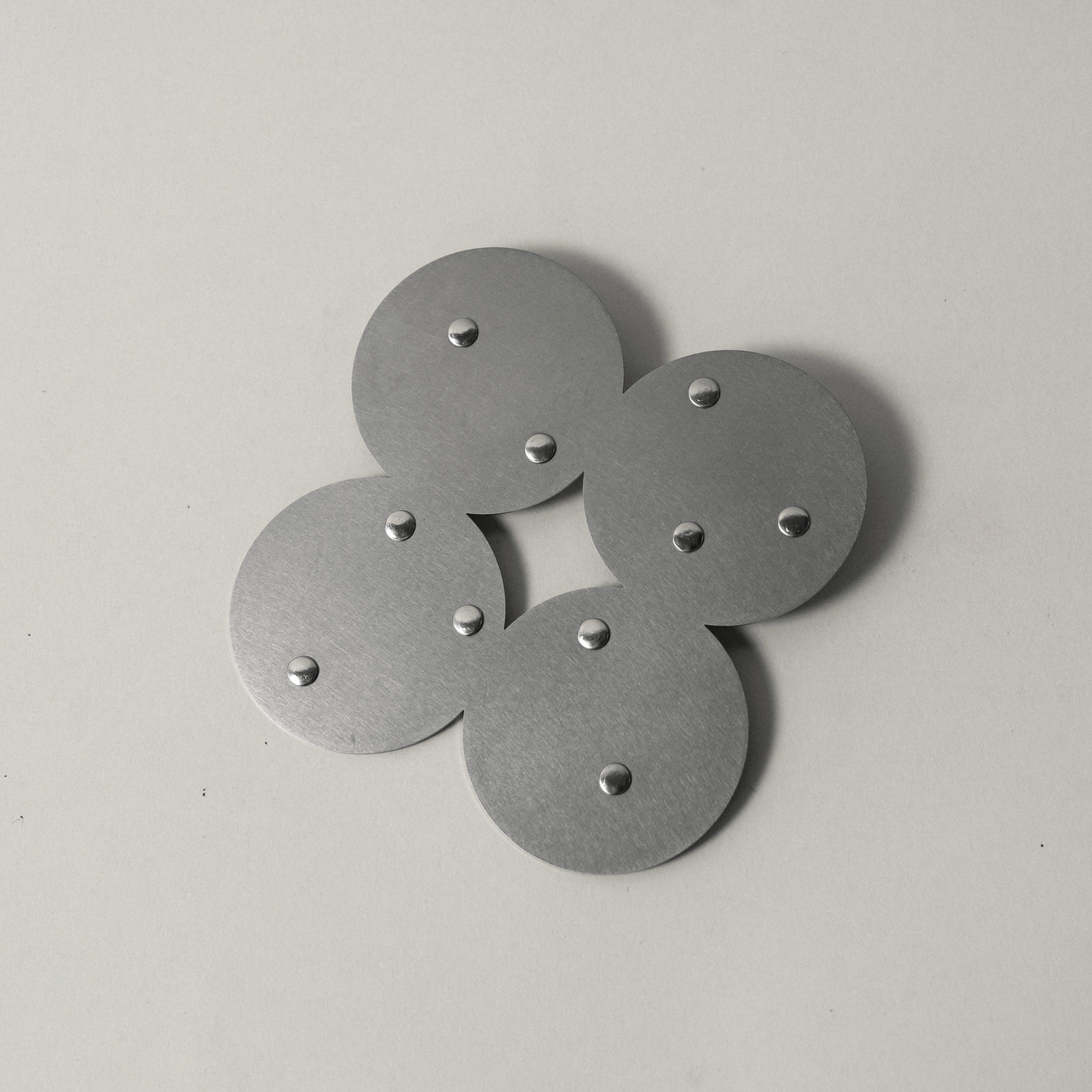 COSMO Coaster A with nickel rivets