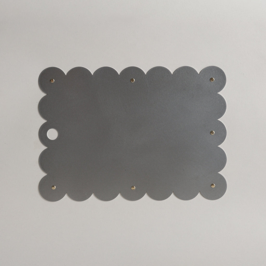 COSMO Placemat with brass rivets