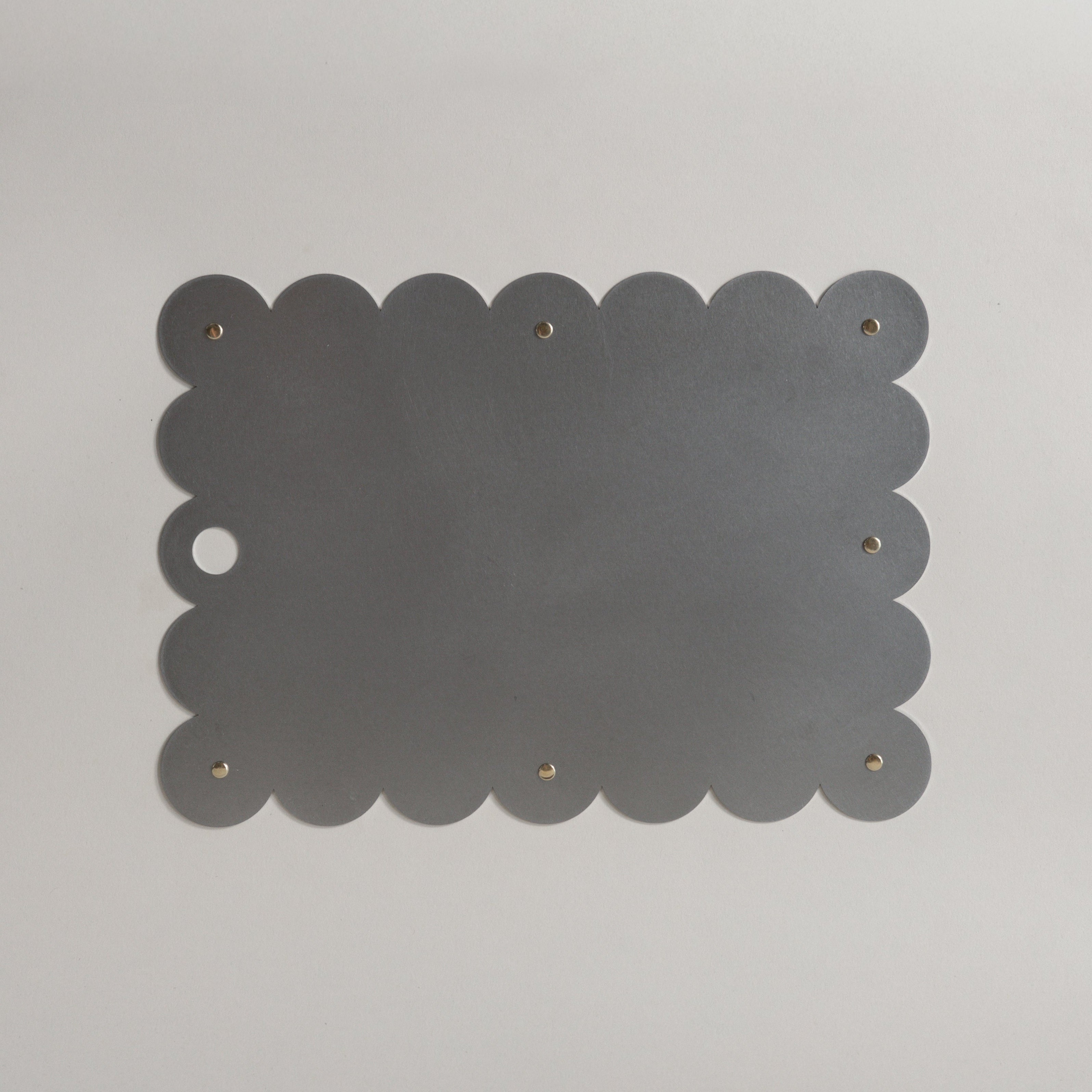 COSMO Placemat with brass rivets