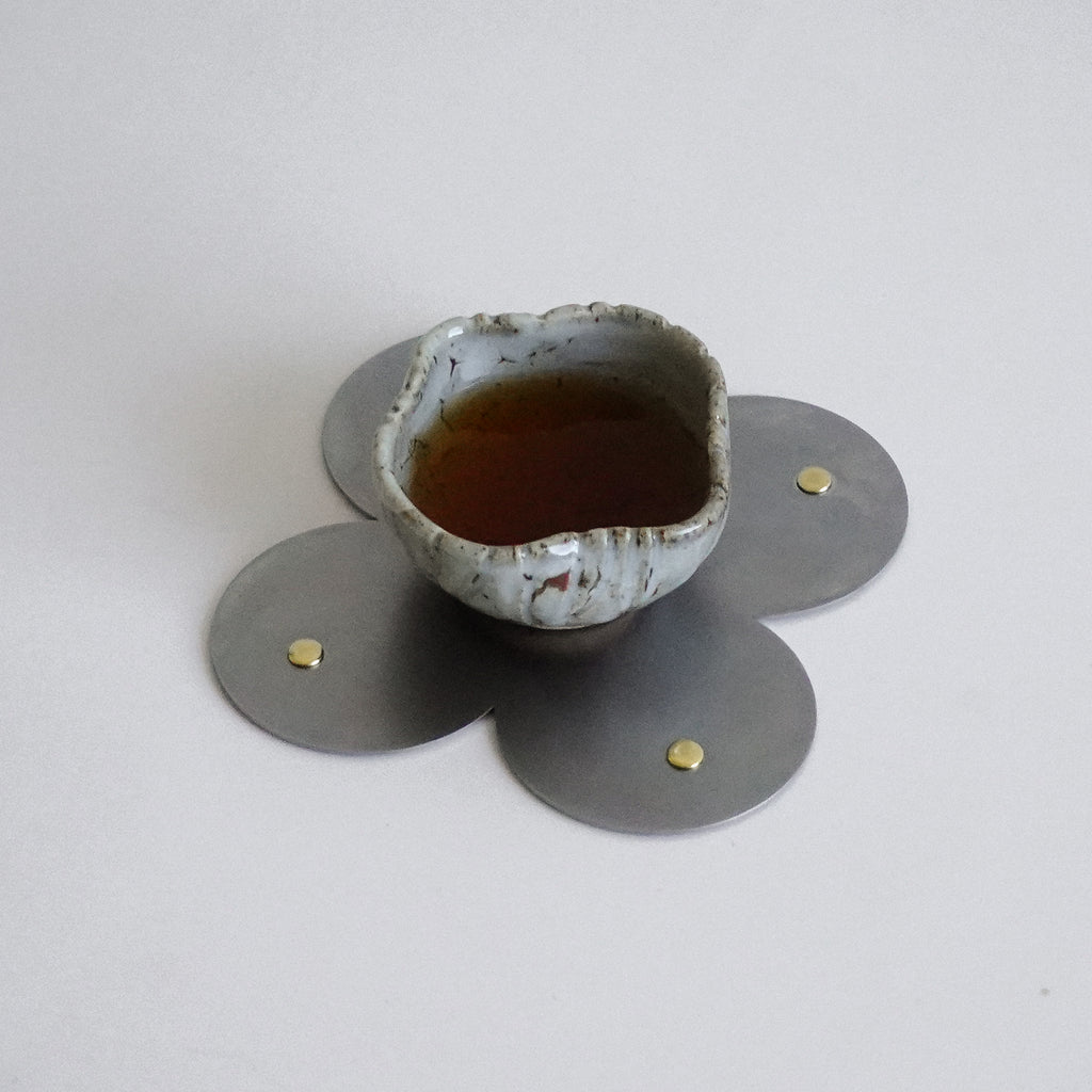 COSMO Coaster B with brass rivets