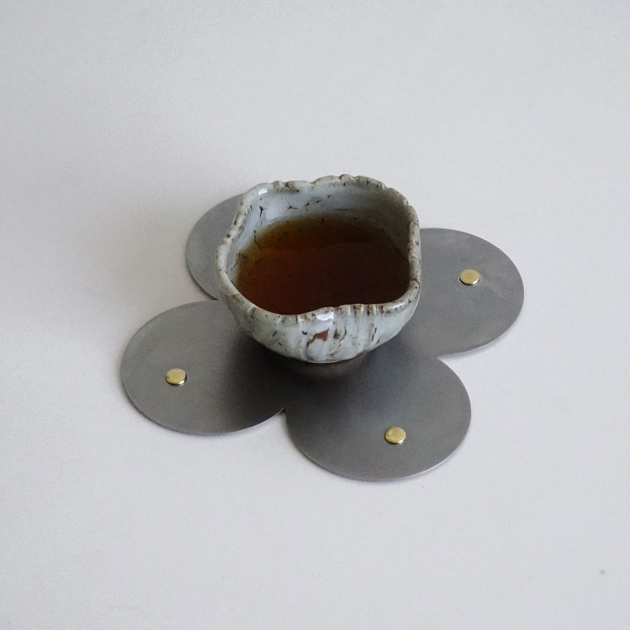 COSMO Coaster B with brass rivets