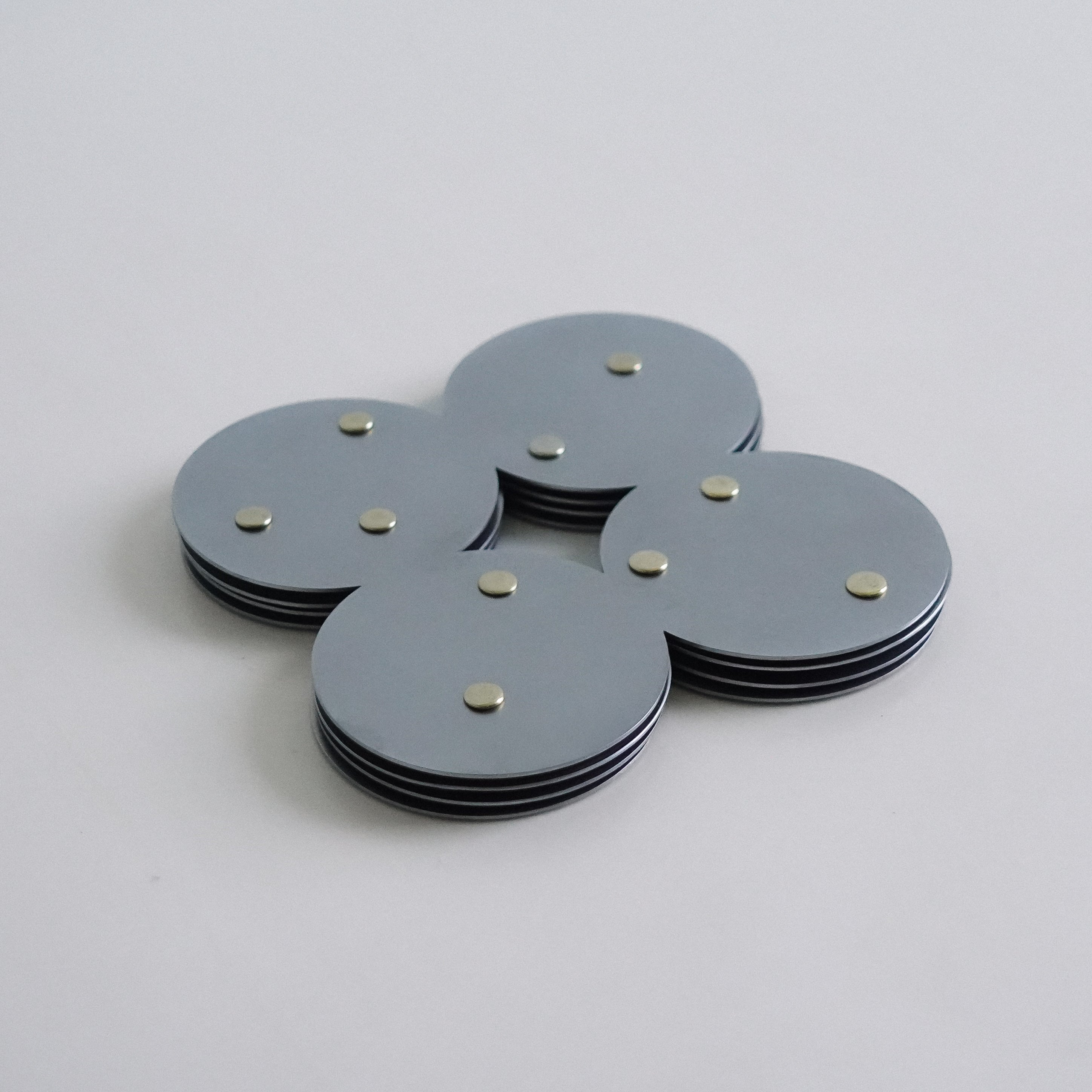 COSMO Coaster A with brass rivets