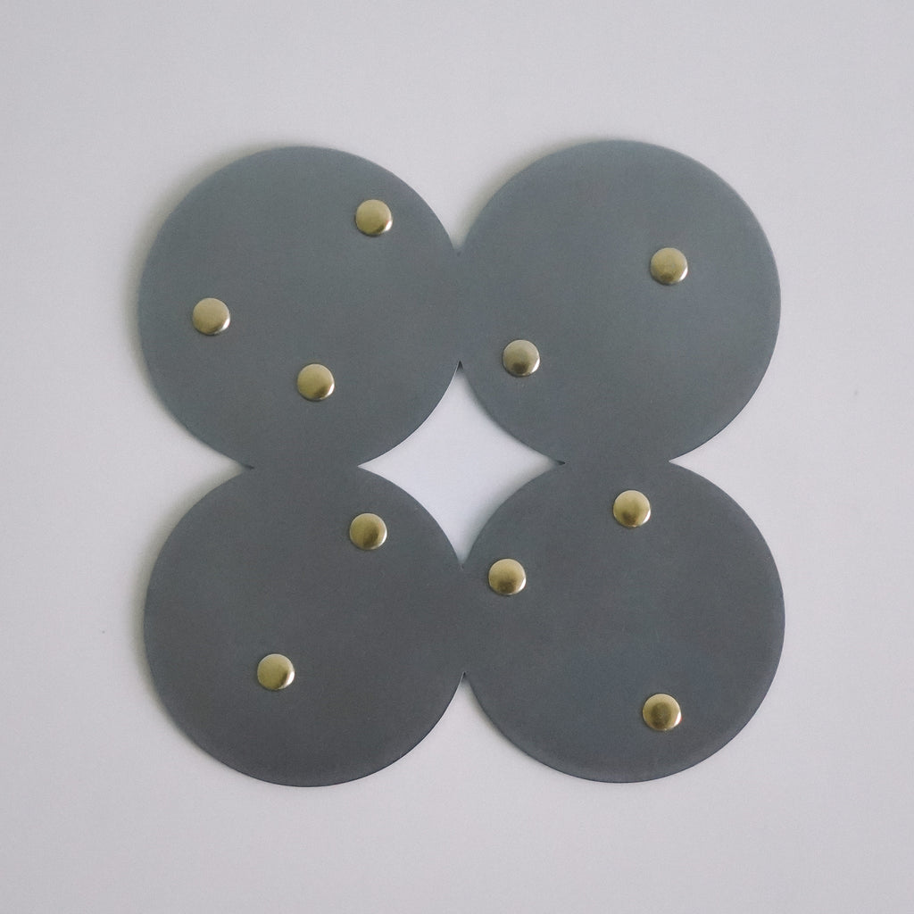 COSMO Coaster A with brass rivets