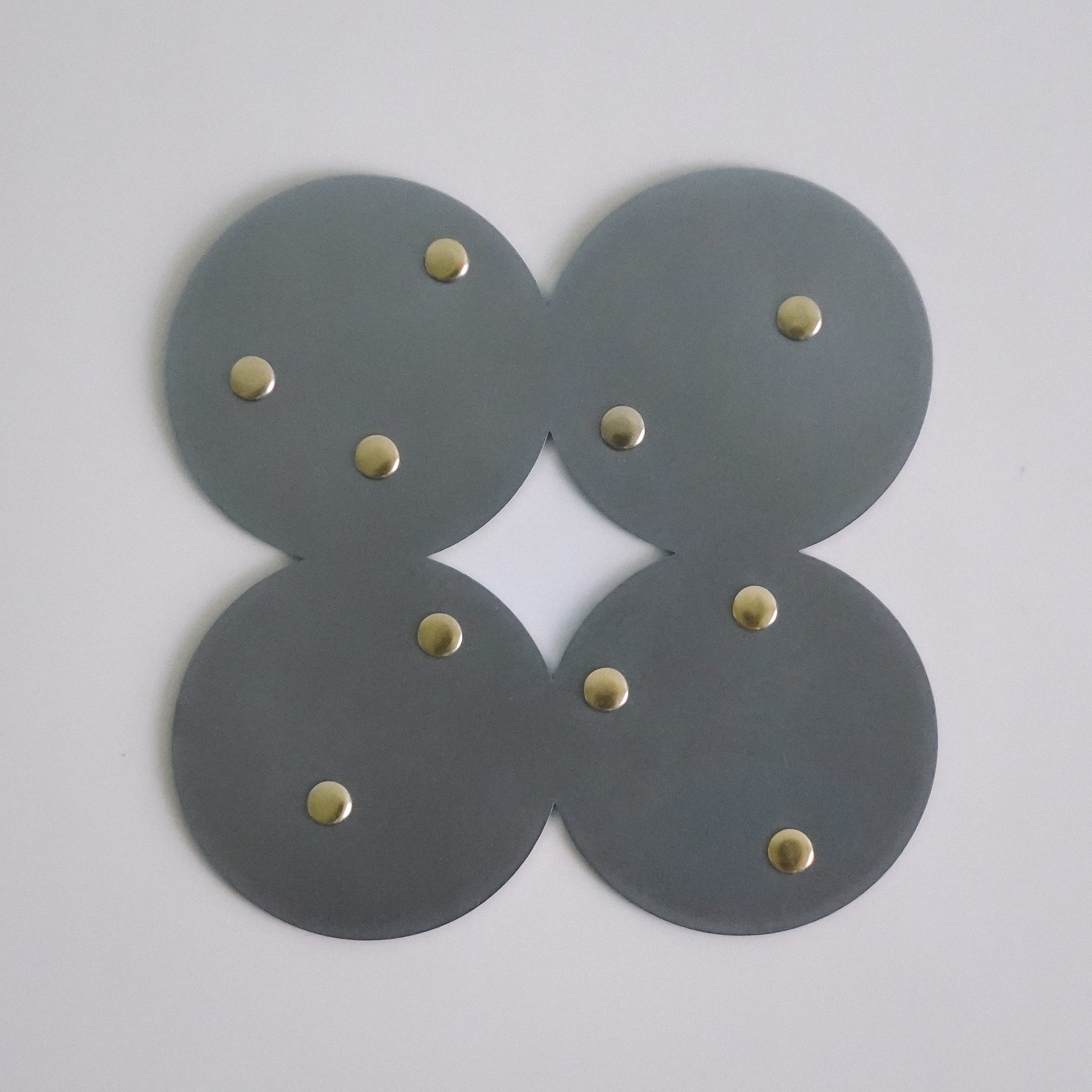 COSMO Coaster A with brass rivets