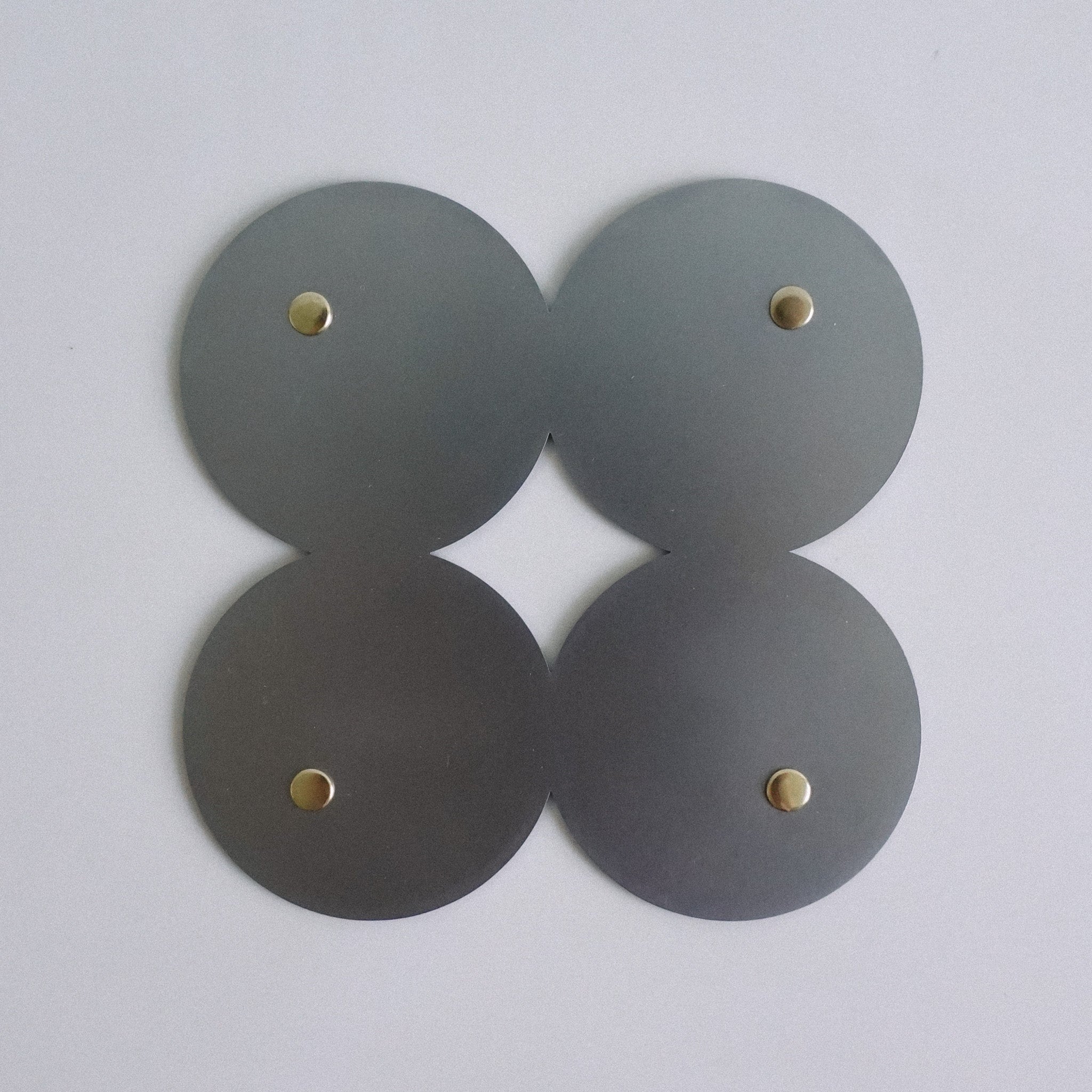 COSMO Coaster B with brass rivets