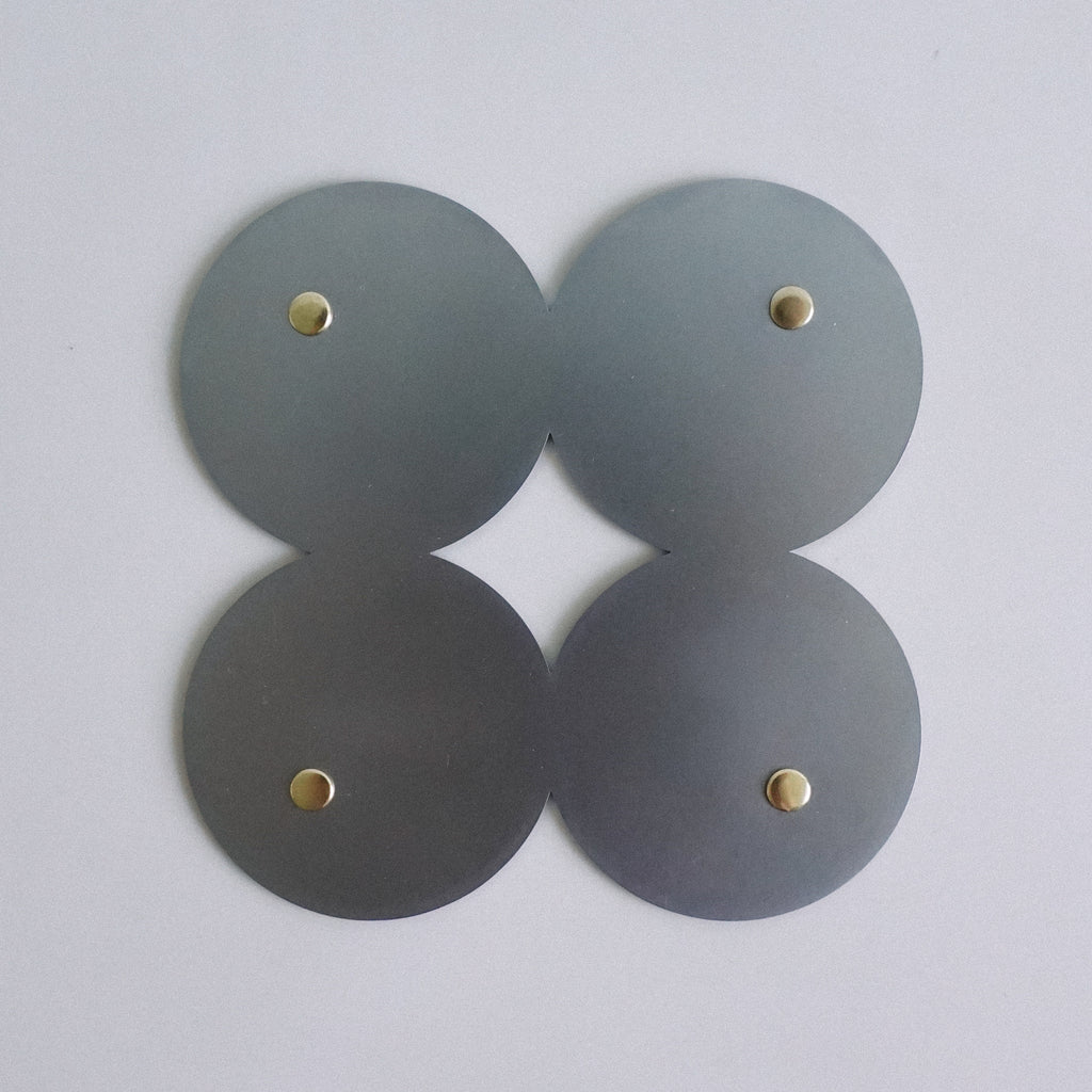 COSMO Coaster B with brass rivets
