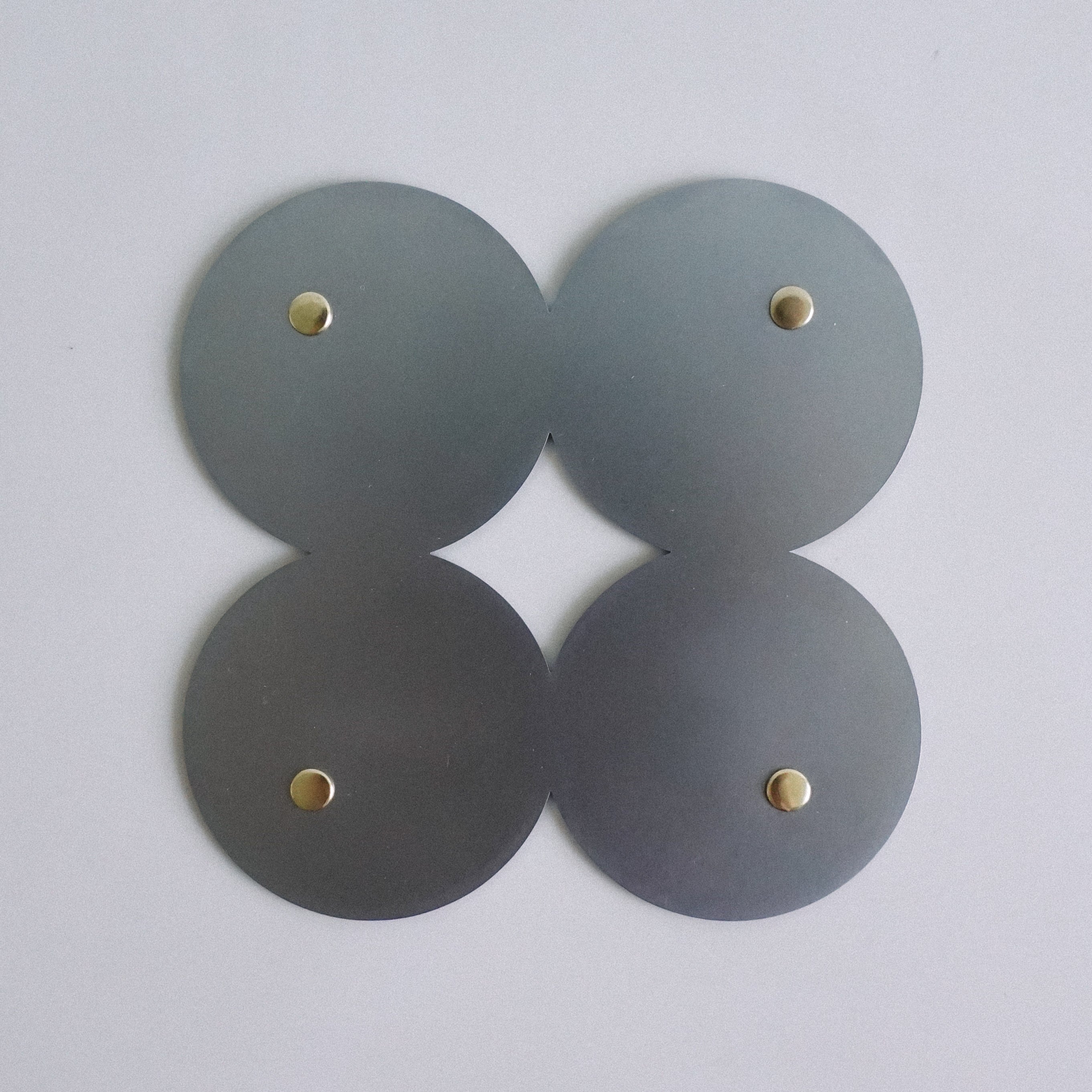 COSMO Coaster B with brass rivets